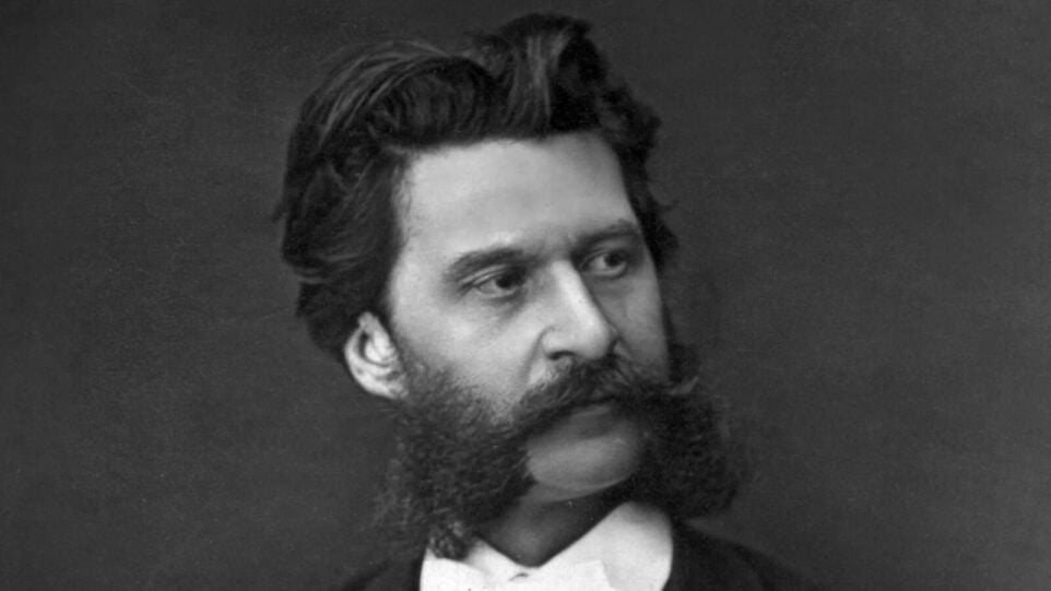 Black and white photograph of Johann Strauss Jr. with imperial beard.