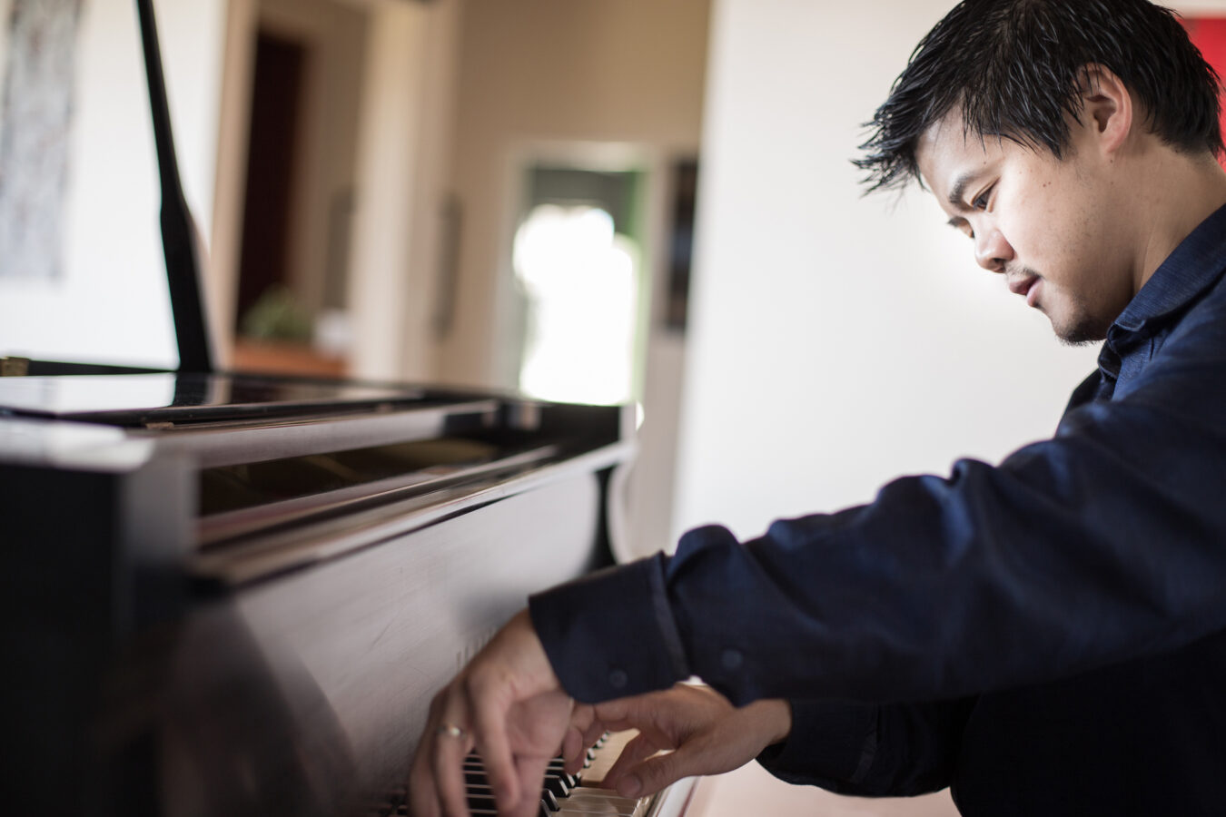 Winston Choi playing a piano
