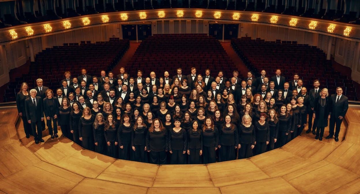 members of the Chicago Symphony Chorus pose on stage at Symphony Center
