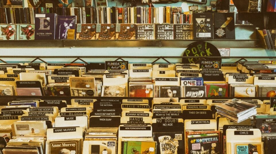CDs and records on a shelf.