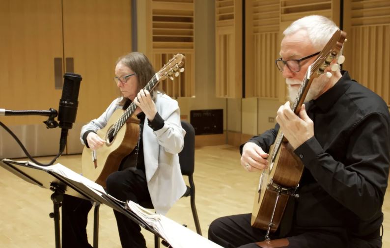 The Waller and Maxwell Guitar Duo performing on stage