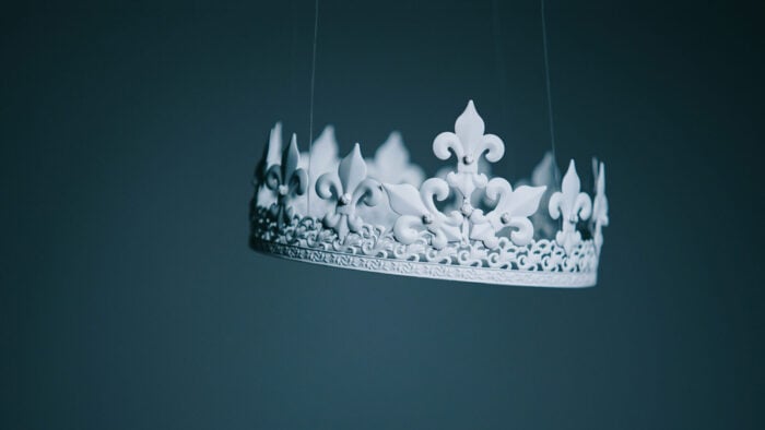 A white crown hanging in mid air