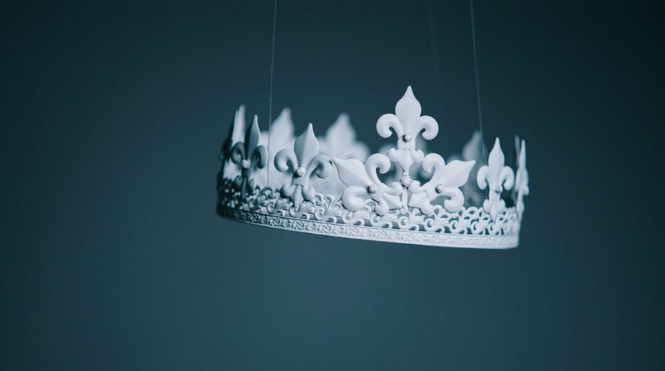 A white crown hanging in mid air
