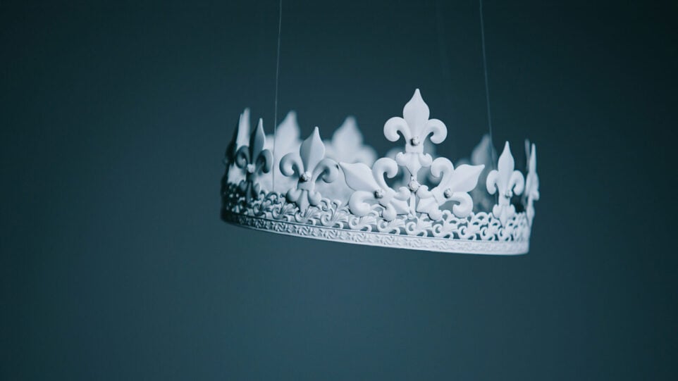 A white crown hanging in mid air