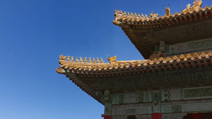 A tower of the Forbidden City with a lot of sky