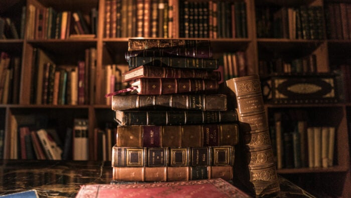 A stack of books in the middle of a library