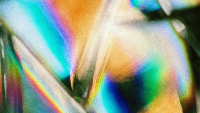 Light creating the color spectrum in glass, at an angle
