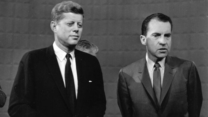 John F. Kennedy and Richard Nixon standing