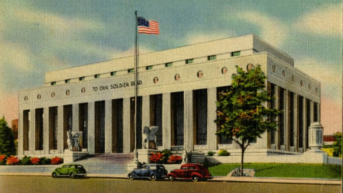 large building with columns and American flag