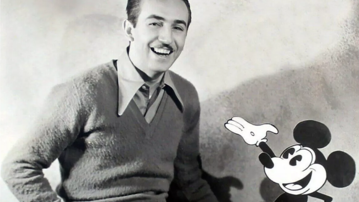 smiling young man with cartoon mouse