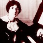 A young Lili Boulanger sits at the organ
