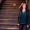 Pianist Simone Dinnerstein poses at a staircase in a city